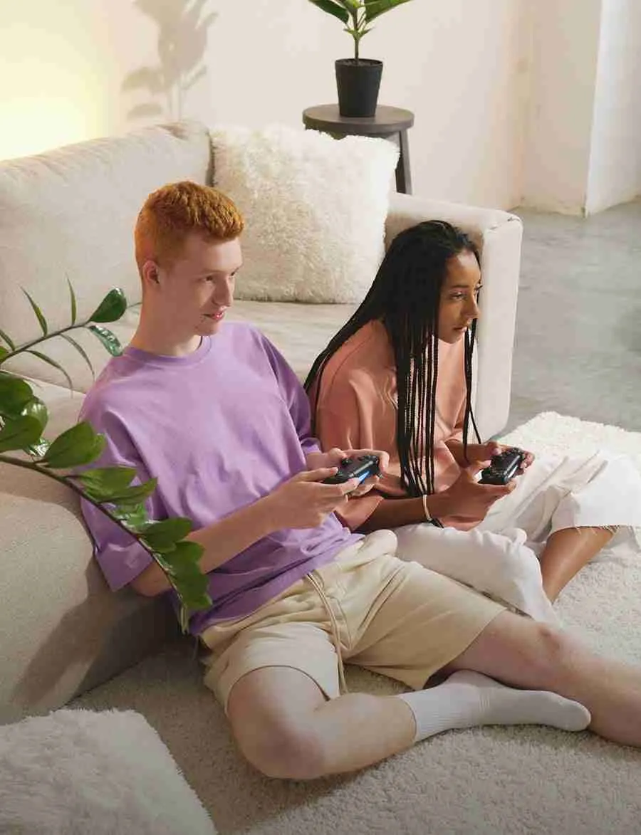 couple playing videogames, while house is cleaned
